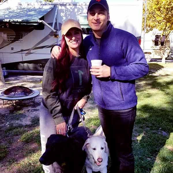 Image of Shana Dahan with her husband Adam Kilbourn and with their lovely pets Labrador