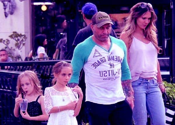 Image of Jessica Rogan with her husband Joe Rogan and with their daughter