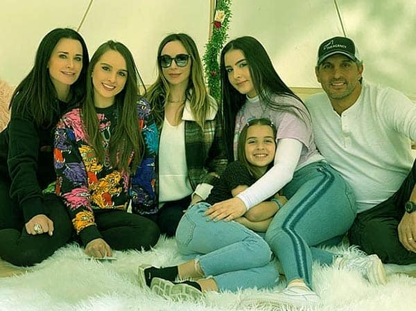 Image of Kyle Richards with her husband Mauricio and with their kids