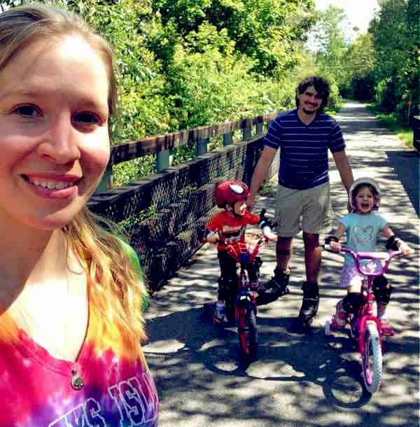 Image of Dr. Emily Thomas with her husband Tony and with their kids