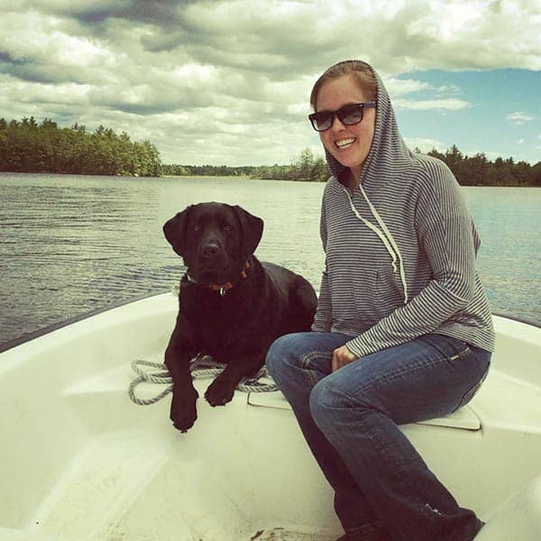 Image of Caption: Ashely Morrill with her dog Labrador Retrievers