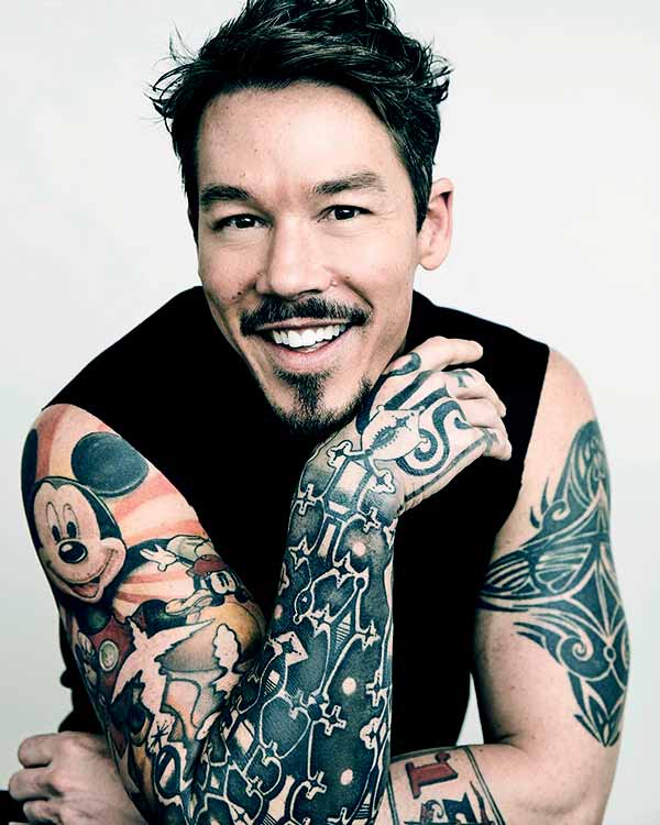 Image of Caption: David Bromstad tattoo of Mickey Mouse on his right shoulder and bicep