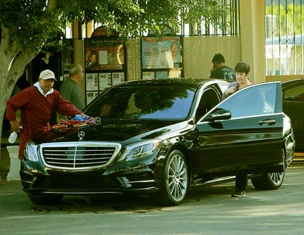 Image of Caption: Connie Kline with her black Mercedes