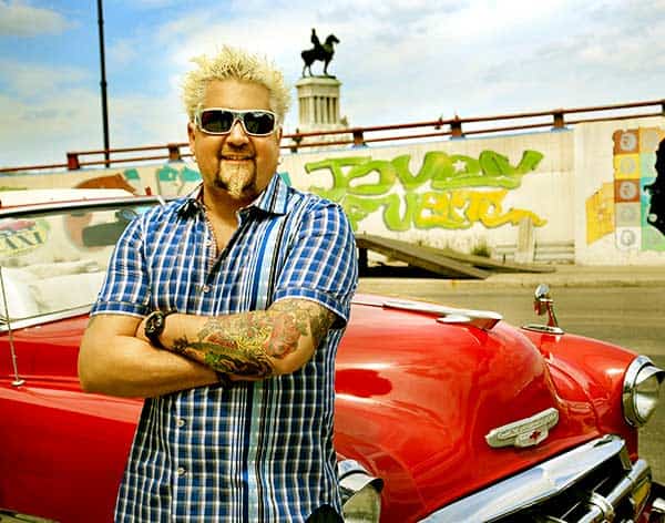 Image of Guy Fieri with his car